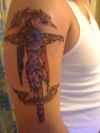 cross and jesus tattoo on arm
